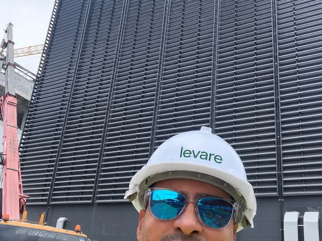 Moustafa Ibrahim on site in front of façade works